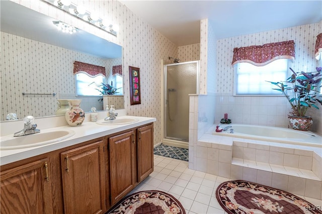 bathroom featuring vanity, tile patterned floors, and shower with separate bathtub