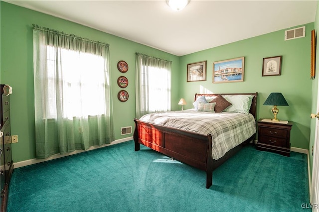 bedroom featuring dark carpet