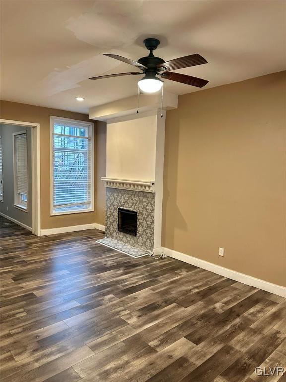 38 12th St, Allentown City, PA 18101 - unfurnished living room with baseboards, dark wood-type flooring, a ceiling fan, a fireplace, and recessed lighting