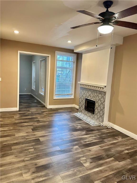 38 12th St, Allentown City, PA 18101 - unfurnished living room with baseboards, a ceiling fan, wood finished floors, a fireplace, and recessed lighting