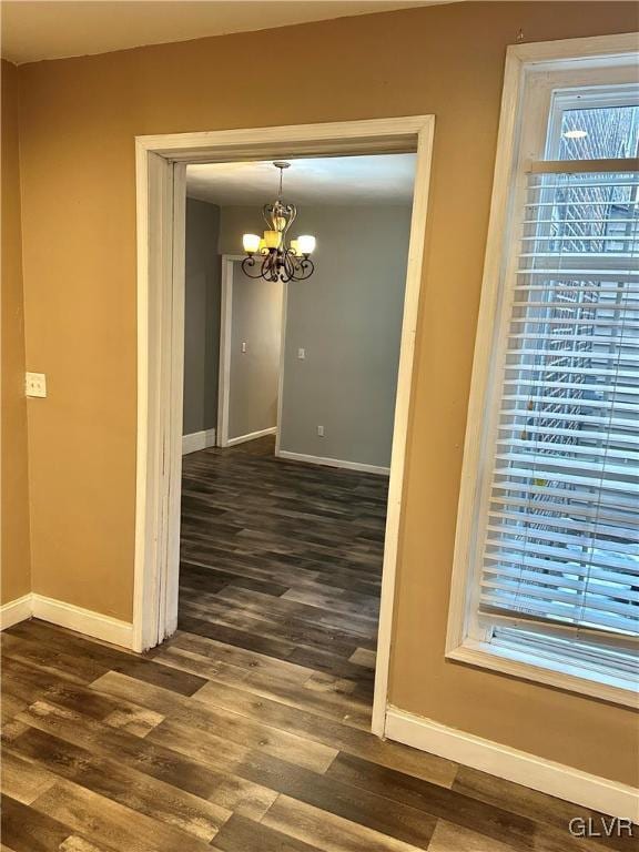 38 12th St, Allentown City, PA 18101 - hall featuring baseboards, a chandelier, and dark wood-style flooring