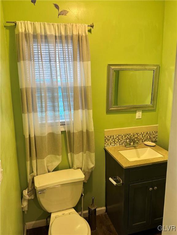 38 12th St, Allentown City, PA 18101 - bathroom featuring vanity, toilet, and baseboards