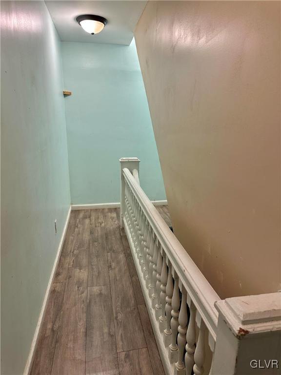 38 12th St, Allentown City, PA 18101 - hall with an upstairs landing, wood finished floors, and baseboards
