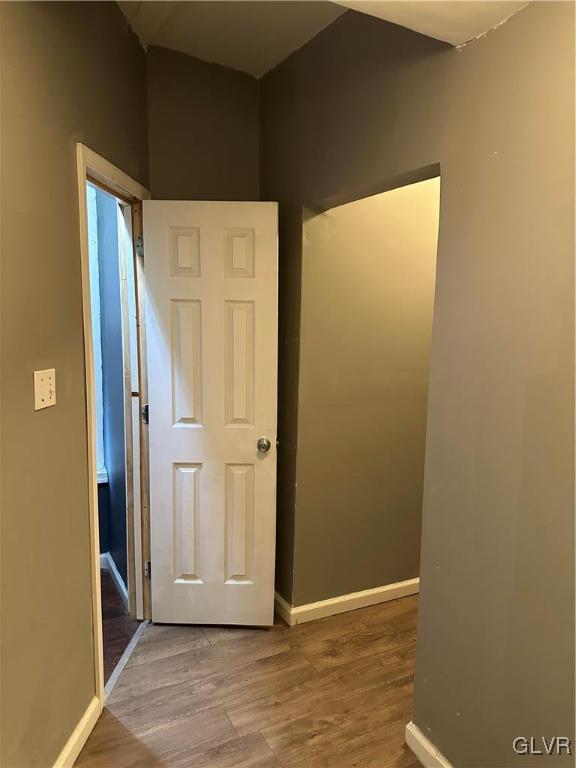 38 12th St, Allentown City, PA 18101 - empty room with wood finished floors and baseboards