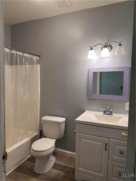 38 12th St, Allentown City, PA 18101 - full bathroom featuring wood finished floors, vanity, toilet, and shower / bathtub combination with curtain