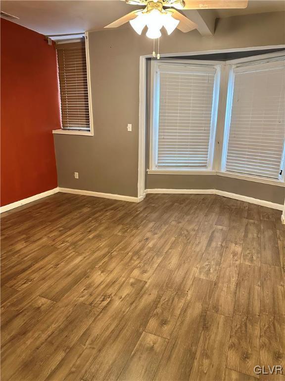 38 12th St, Allentown City, PA 18101 - empty room featuring ceiling fan, baseboards, and wood finished floors