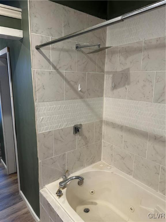38 12th St, Allentown City, PA 18101 - full bathroom with wood finished floors and a combined bath / shower with jetted tub