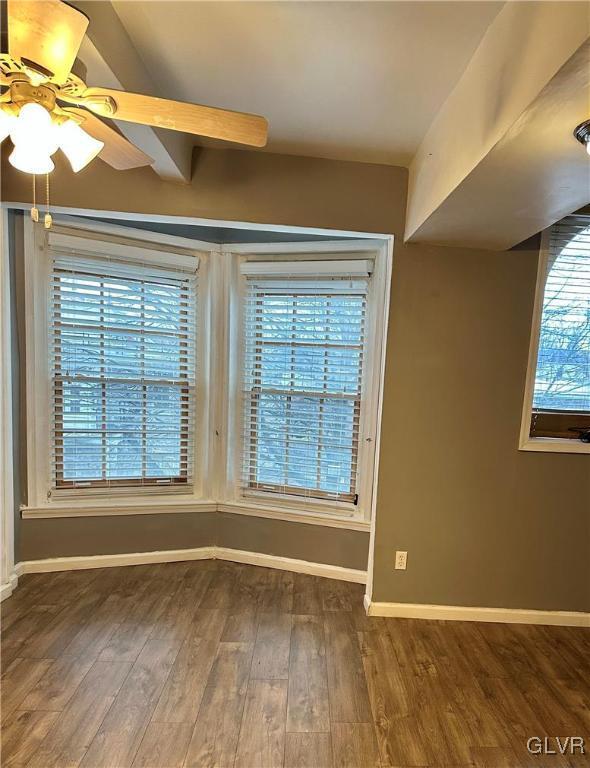 38 12th St, Allentown City, PA 18101 - spare room featuring baseboards, wood finished floors, and ceiling fan