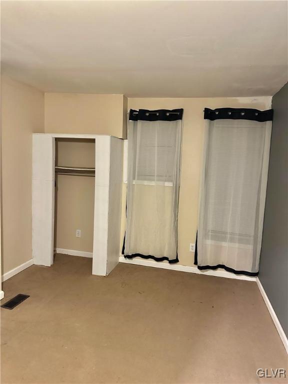 38 12th St, Allentown City, PA 18101 - unfurnished bedroom featuring carpet, baseboards, and a closet
