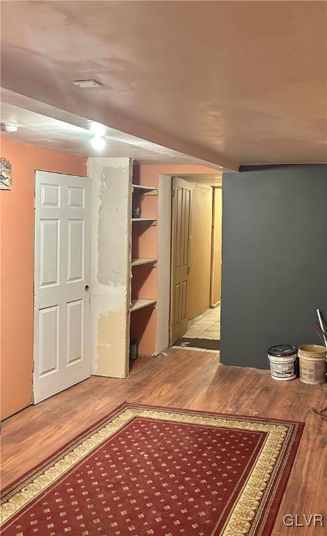 38 12th St, Allentown City, PA 18101 - unfurnished bedroom featuring wood finished floors