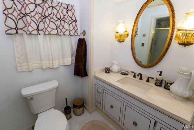 bathroom with vanity and toilet