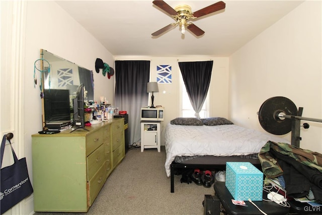 carpeted bedroom with ceiling fan