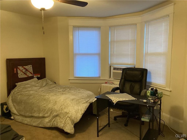 bedroom with cooling unit and ceiling fan