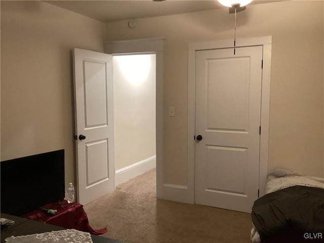 bedroom featuring light carpet