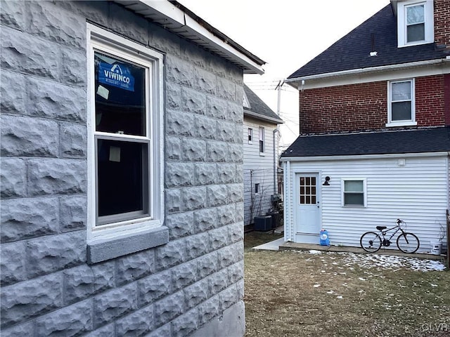 view of home's exterior with cooling unit