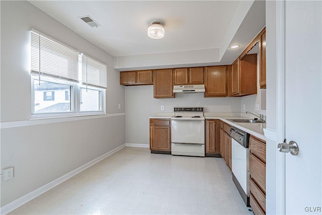 kitchen featuring white appliances and sink