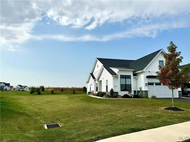 view of side of home with a lawn