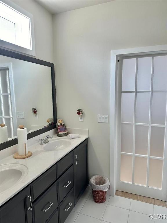 bathroom with vanity and tile patterned floors