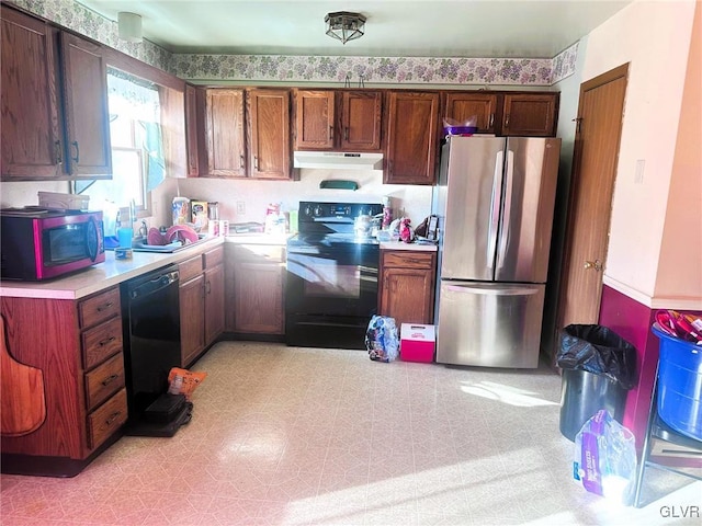 kitchen featuring sink and black appliances