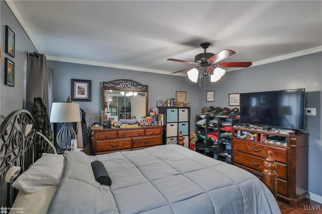 bedroom with crown molding and ceiling fan