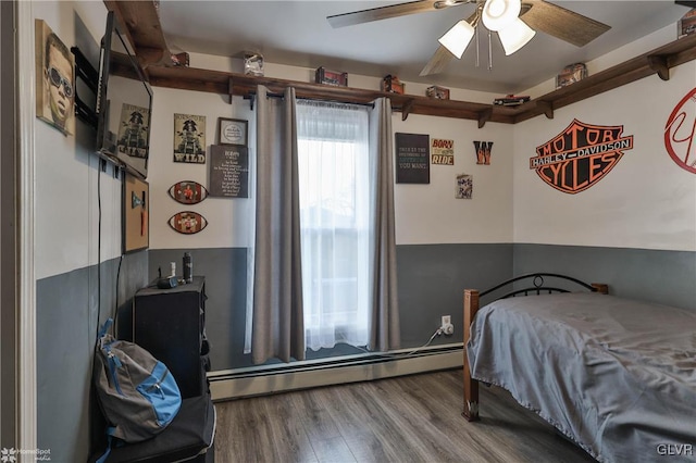 bedroom with a baseboard radiator, wood-type flooring, and ceiling fan