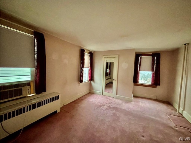 interior space with radiator and a baseboard radiator