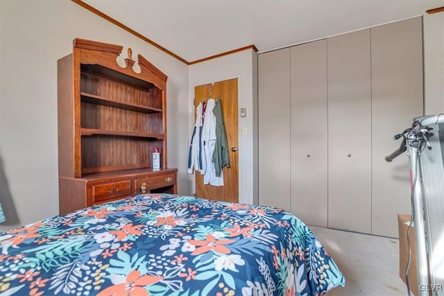 bedroom with ornamental molding and a closet