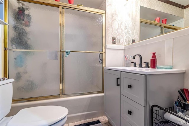 full bathroom with vanity, shower / bath combination with glass door, and toilet