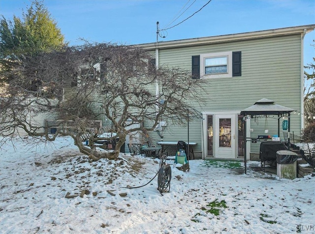 snow covered property featuring a gazebo