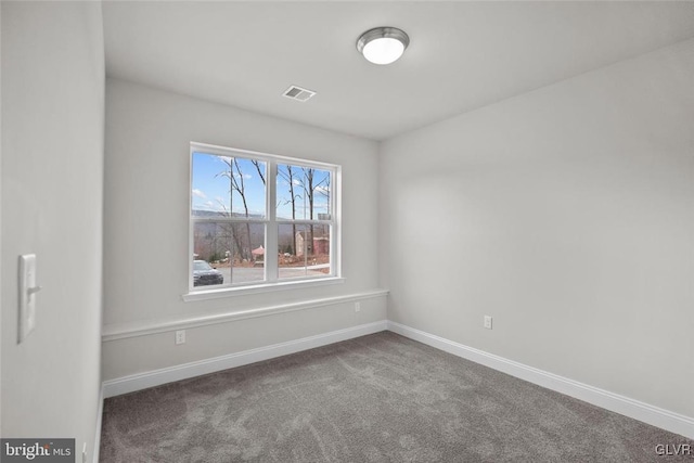 unfurnished room featuring carpet flooring