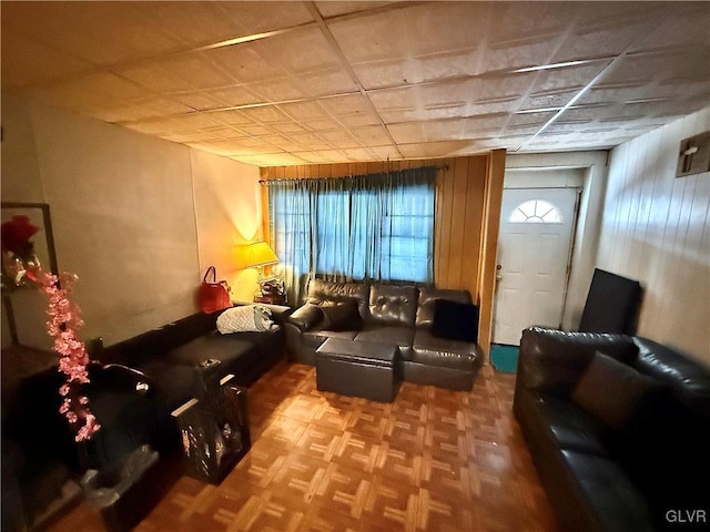 living room with a wealth of natural light and parquet flooring