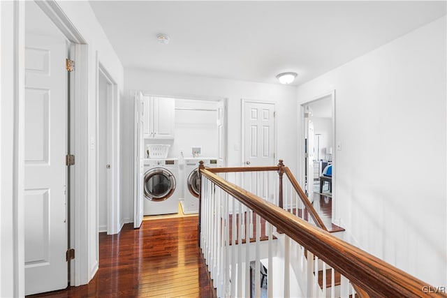 corridor featuring separate washer and dryer and dark wood-type flooring