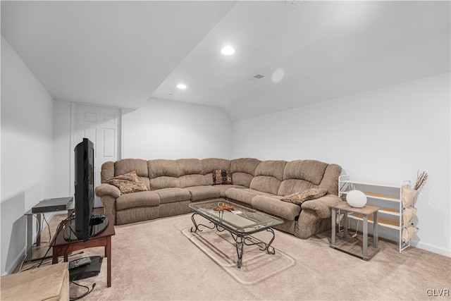 living room with vaulted ceiling and light carpet