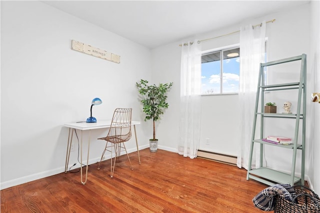 interior space with a baseboard radiator and wood-type flooring