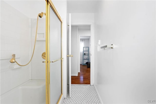 bathroom featuring walk in shower and tile patterned floors