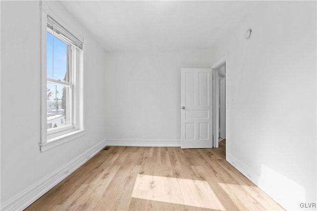 unfurnished room featuring light hardwood / wood-style flooring