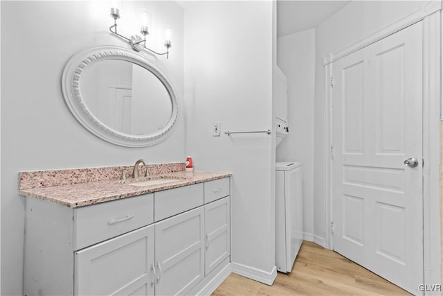 bathroom with wood-type flooring and vanity