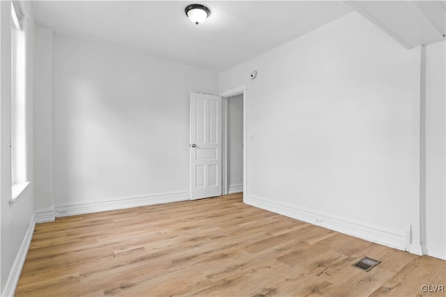 unfurnished room featuring light hardwood / wood-style flooring