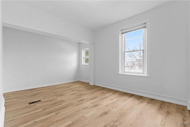 unfurnished room featuring light hardwood / wood-style flooring