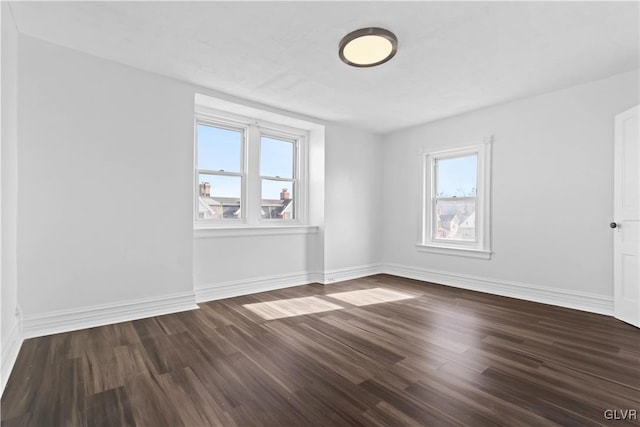 unfurnished room with hardwood / wood-style floors