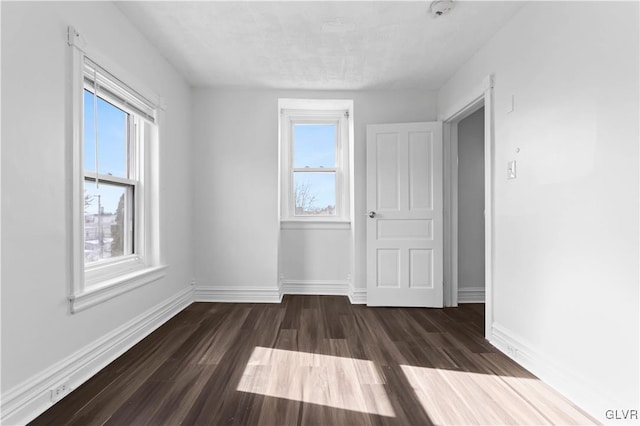 empty room featuring dark hardwood / wood-style floors