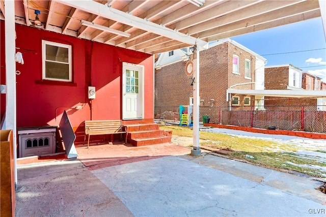 entrance to property featuring a patio