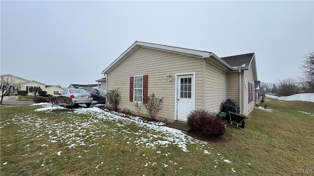 view of snowy exterior featuring a yard