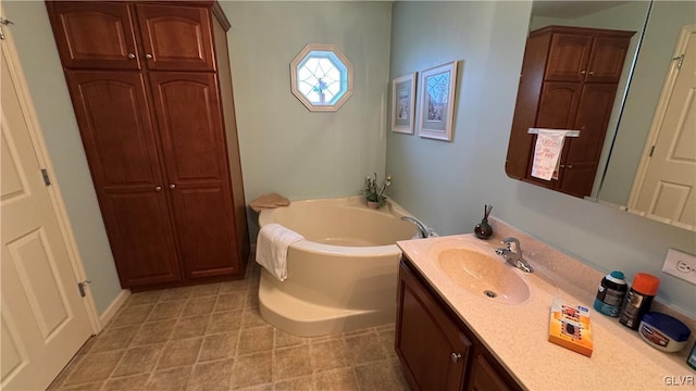 bathroom featuring vanity and a bath