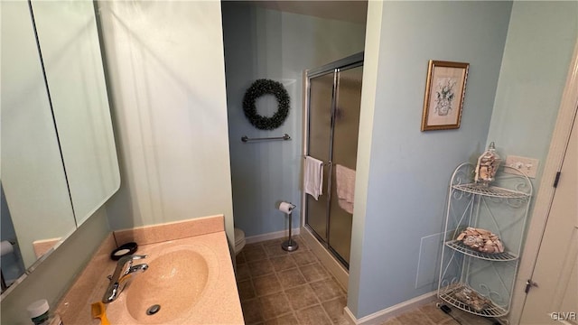 bathroom featuring walk in shower, toilet, and sink