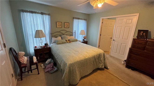 carpeted bedroom featuring ceiling fan