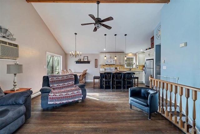 living room featuring a baseboard heating unit, hardwood / wood-style floors, a wall unit AC, high vaulted ceiling, and ceiling fan with notable chandelier