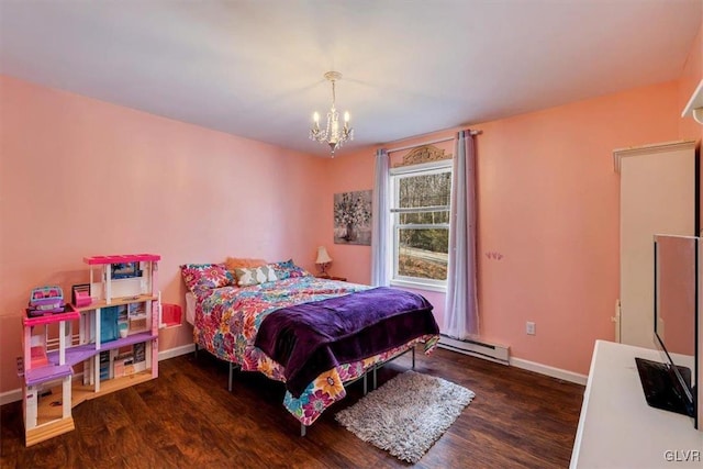 bedroom with an inviting chandelier, a baseboard heating unit, and dark wood-type flooring