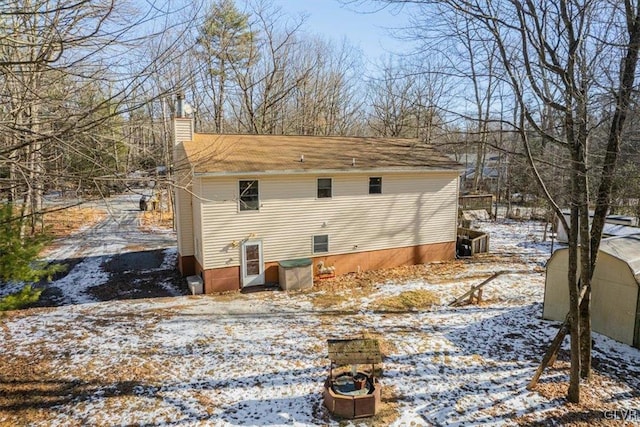 view of snow covered house