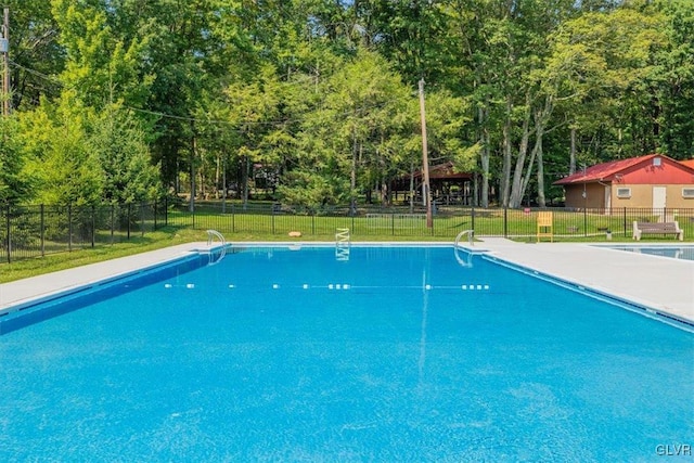 view of pool featuring a yard